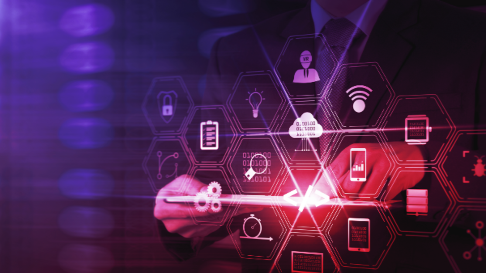 A person interacts with a glowing hexagonal interface of software and technology icons