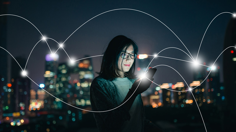 Woman surrounded by bright lights
