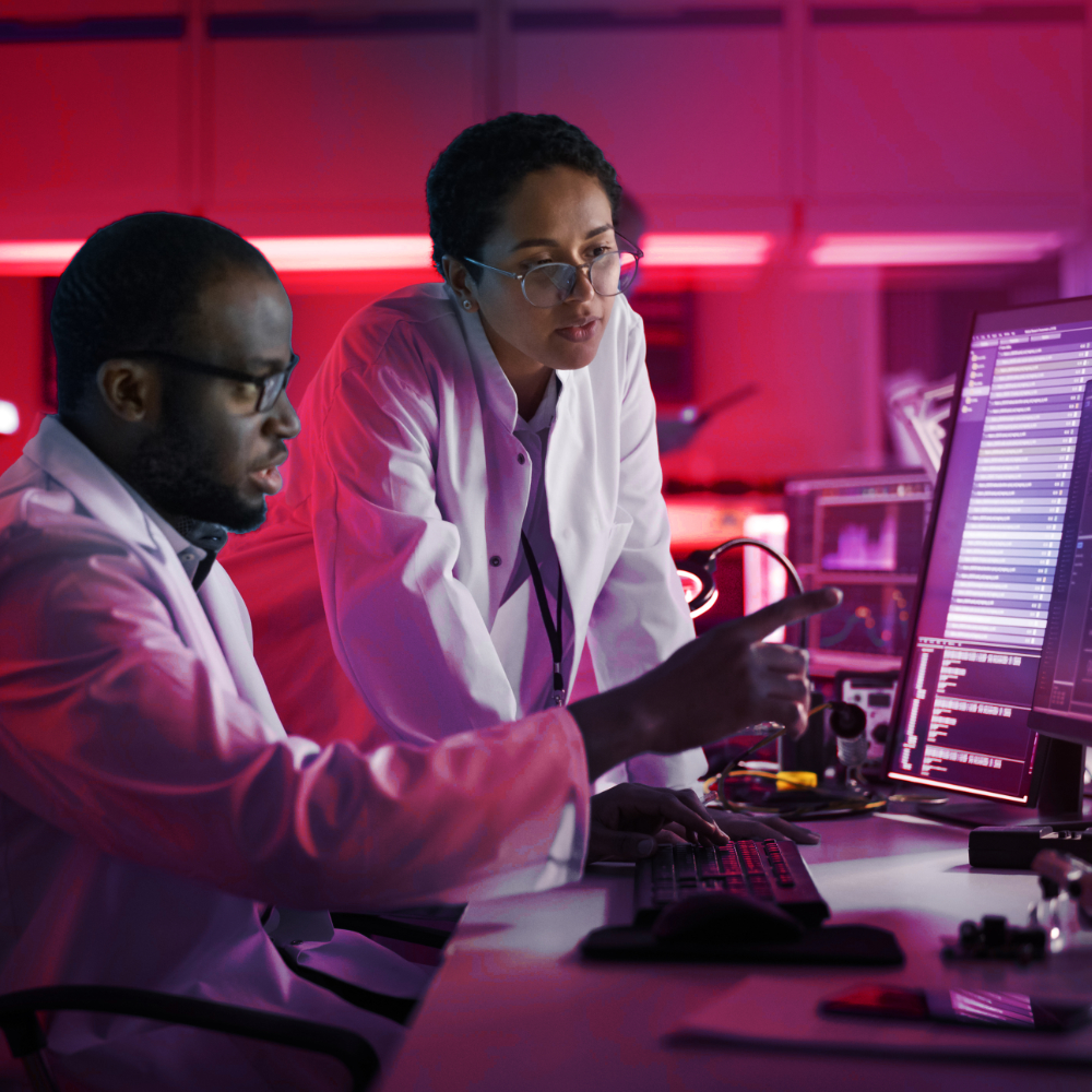 two security experts working in a lab
